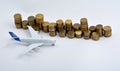 Plane plastic toy with coins isolated on white Royalty Free Stock Photo