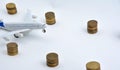 Plane plastic toy with coins isolated on white Royalty Free Stock Photo