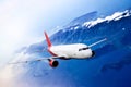 Plane red cloud travel transportion airplane mountains Royalty Free Stock Photo