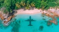 Plane reflected in the turquoise waters of a paradise beach, with white sand and palm trees Royalty Free Stock Photo