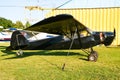 Small plane on the runway, airplane barn