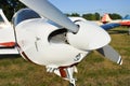 Small plane on the runway, airplane barn, Engine and propeller of small private lightweight vintage airplane closeup Royalty Free Stock Photo