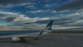 The plane is on the runway. There are marking strips and warning signs on the asphalt. Royalty Free Stock Photo