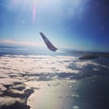 Air New Zealand plane`s wing flying over Tahiti