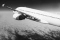 Plane in the sky flight travel transport airplane background black white Royalty Free Stock Photo