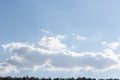 The plane in the sky takes off over the white fluffy clouds. Lightness, lightness, weightlessness