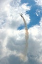 Plane with smoke trail Royalty Free Stock Photo