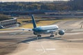 The plane started taxiing into the runway and hold for takeoff in the morning Royalty Free Stock Photo