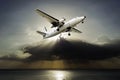 Plane with sunbeam and cloud storm Royalty Free Stock Photo