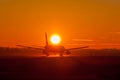 Plane in sunset Royalty Free Stock Photo