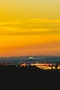 The plane takes off from the airport runway during sunset at dusk Royalty Free Stock Photo