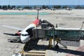 The plane at the telescopic gangway at the airport Royalty Free Stock Photo