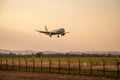 Large airliner just before landing in the evening at sunset. Royalty Free Stock Photo