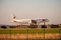 Large airliner just before landing in the evening at sunset. Royalty Free Stock Photo