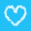 Plane track or white cloud heart isolated on blue background Royalty Free Stock Photo