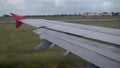 The plane travels on the ground. View from the airplane window to the wing.