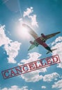 Image of plane with the word cancelled written in red, related with the corona virus