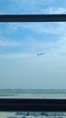 A plane viewed from window at the airport