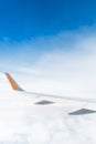 Plane wing with blue sky. Royalty Free Stock Photo