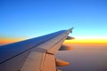 Plane wing on sunset sky Royalty Free Stock Photo