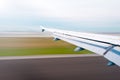 Plane wing at take off or landing. Royalty Free Stock Photo