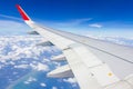 Plane wings over the sky and white clouds View from inside the plane Royalty Free Stock Photo
