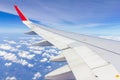 Plane wings over the sky and white clouds View from inside the plane Royalty Free Stock Photo
