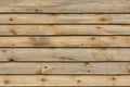 Planed wooden boards surface texture with branches background