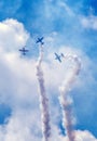 Planes doing aerial stunts at a show