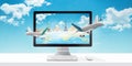 Planes flying out of the computer display. Concept of booking holiday and planning a trip online Royalty Free Stock Photo