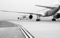 Planes on foggy runway