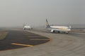 Plane line up for take in fog Royalty Free Stock Photo