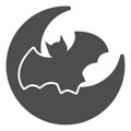 Planet and bat solid icon. Night crescent moon and flying mouse. Halloween party vector design concept, glyph style