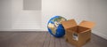 Composite image of planet earth and brown cardboard box Royalty Free Stock Photo