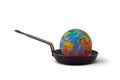 Planet earth in a frying pan - Global warming concept Royalty Free Stock Photo