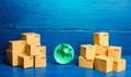 Planet Earth globe and cardboard boxes. Delivering goods and products around the world. International trade and transportation