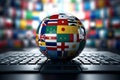 planet earth globe with the flags of different countries from around the globe on a laptop keyboard Royalty Free Stock Photo