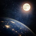 Planet Earth and Moon. View from space to the night sky with stars, the Earth, the Moon. Elements of this image furnished by NASA Royalty Free Stock Photo