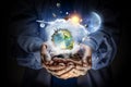 Planet Earth in our hands . Mixed media Royalty Free Stock Photo