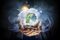 Planet Earth in our hands . Mixed media Royalty Free Stock Photo