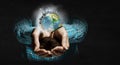 Planet Earth in our hands . Mixed media Royalty Free Stock Photo