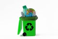 Planet Earth into recycle can with plastic trash - Concept of recycling and ecology Royalty Free Stock Photo