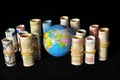 Planet Earth and Rolled Money Royalty Free Stock Photo