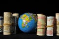 Planet Earth and Rolled Money Royalty Free Stock Photo