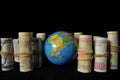 Planet Earth and Rolled Money Royalty Free Stock Photo