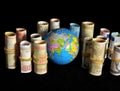 Planet Earth and Rolled Money Royalty Free Stock Photo