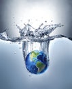 Planet Earth, splashing into water. Royalty Free Stock Photo