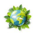 Planet Earth and tropical leaves on white background