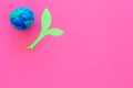 Planet, ecology. plastiline symbol of planet Earth globe and plant coutout on pink background top view copy space