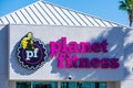 Planet Fitness sign on the fitness club. Planet Fitness is American franchisor and operator of fitness centers Royalty Free Stock Photo